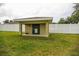 Outdoor shed featuring green door in an expansive lawn at 6011 Country Walk Ln, Winter Haven, FL 33880