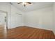 Bright bedroom features wood floors, a ceiling fan and a closet for all your storage needs at 608 Swanson St, Groveland, FL 34736