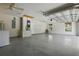 Spacious garage with a large overhead door, plenty of room for parking and storage, plus a utility sink at 608 Swanson St, Groveland, FL 34736