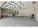 Spacious garage with a large overhead door, plenty of room for parking and storage, plus a utility sink at 608 Swanson St, Groveland, FL 34736