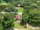 A charming golf course home site with mature landscaping and lush, green lawn at 6301 Parson Brown Dr, Orlando, FL 32819