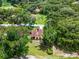 A charming golf course home site with mature landscaping and lush, green lawn at 6301 Parson Brown Dr, Orlando, FL 32819