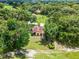 A charming golf course home site with mature landscaping and lush, manicured lawn at 6301 Parson Brown Dr, Orlando, FL 32819