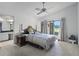 Bright bedroom featuring a ceiling fan and sliding glass doors to the outdoor area at 6301 Parson Brown Dr, Orlando, FL 32819