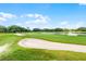 Picturesque golf course featuring green fairways, sand traps, and a water hazard at 6301 Parson Brown Dr, Orlando, FL 32819