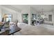 Spacious living area featuring neutral carpet, ample natural light from sliding doors to patio at 6301 Parson Brown Dr, Orlando, FL 32819