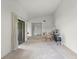 Bright and open living area with neutral carpet, leading to entryway and outdoor patio at 6301 Parson Brown Dr, Orlando, FL 32819