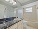 Bathroom with marble countertop and bathtub at 750 Olympic Cir # D1, Ocoee, FL 34761