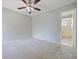 Neutral bedroom featuring a ceiling fan and ensuite bathroom at 750 Olympic Cir # D1, Ocoee, FL 34761