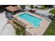 Community pool with lounge seating and a covered picnic area at 750 Olympic Cir # D1, Ocoee, FL 34761