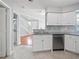 Modern kitchen with stainless steel dishwasher and sink; open to living space at 750 Olympic Cir # D1, Ocoee, FL 34761