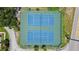 Aerial view of community tennis courts in good condition at 750 Olympic Cir # D1, Ocoee, FL 34761
