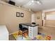 Functional bonus room with a ceiling fan, storage shelves, and a multi-colored rug at 901 Grovesmere Loop, Ocoee, FL 34761