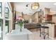 Open living room featuring modern decor, large windows, and seamless transition to the kitchen at 901 Grovesmere Loop, Ocoee, FL 34761