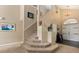 Entryway staircase features neutral decor, contemporary lighting, and a welcoming entrance at 901 Grovesmere Loop, Ocoee, FL 34761