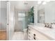 Modern bathroom showcasing a glass-enclosed shower, updated vanity, and neutral tiling at 9355 Telfer Run, Orlando, FL 32817