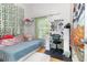 A vibrant bedroom with a light blue bed and string lights on the wall at 9355 Telfer Run, Orlando, FL 32817