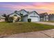 Charming single-Gathering home featuring a well-maintained lawn and attached two-car garage at 9355 Telfer Run, Orlando, FL 32817