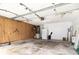 Spacious garage with pegboard wall, storage options, and ceiling fans for optimal ventilation at 9355 Telfer Run, Orlando, FL 32817