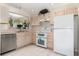 Well-lit kitchen featuring updated appliances and bright countertops at 9355 Telfer Run, Orlando, FL 32817