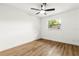 Empty bedroom with modern ceiling fan, hardwood floors, and a window at 955 Tomes Ct, Orlando, FL 32825