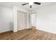 Bright bedroom with hardwood floors, a modern ceiling fan, and a closet at 955 Tomes Ct, Orlando, FL 32825