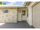 Inviting front entry showcasing a stained glass door and stone accents at 955 Tomes Ct, Orlando, FL 32825
