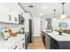 Stylish kitchen featuring a black island and stainless steel appliances at 955 Tomes Ct, Orlando, FL 32825