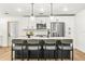 Modern kitchen featuring a central island with seating and pendant lighting at 955 Tomes Ct, Orlando, FL 32825