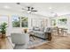 Open-concept living room offering lots of natural light, stylish furniture, and decor at 955 Tomes Ct, Orlando, FL 32825
