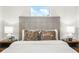 Comfortable main bedroom with plush pillows, a padded headboard, and wooden nightstands at 955 Tomes Ct, Orlando, FL 32825