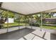Relaxing screened-in patio overlooking a green backyard at 955 Tomes Ct, Orlando, FL 32825
