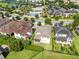 Aerial view of the home, lush backyard, and community pool and recreation area at 9978 Mere Pkwy, Orlando, FL 32832