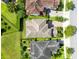 Bird's-eye view of the home highlighting the roof, backyard, and adjacent street at 9978 Mere Pkwy, Orlando, FL 32832