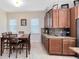 Cozy dining area with wood table and chairs, positioned near the kitchen with ample natural light at 9978 Mere Pkwy, Orlando, FL 32832