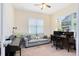 Bright home office with two large windows and natural light, creating an inviting workspace at 9978 Mere Pkwy, Orlando, FL 32832