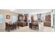 Open-concept kitchen featuring stainless steel appliances, island seating, and a dining area at 9978 Mere Pkwy, Orlando, FL 32832