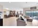 Inviting living room with access to the kitchen, outdoor patio, and with neutral décor at 9978 Mere Pkwy, Orlando, FL 32832