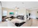 Spacious living room featuring tile flooring, recessed lighting, and a ceiling fan at 9978 Mere Pkwy, Orlando, FL 32832