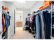 Spacious walk-in closet with built-in shelving and plenty of room for storage at 9978 Mere Pkwy, Orlando, FL 32832