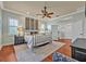 Bright bedroom with a metal bed frame, ceiling fan, and light-colored walls with white trim at 339 Carolyn Dr, Oviedo, FL 32765