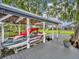 Boat dock with a covered boat lift, offering convenience for boat storage and easy water access at 339 Carolyn Dr, Oviedo, FL 32765