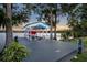 Covered boat house with a boat lift, offering easy lake access and scenic views at 339 Carolyn Dr, Oviedo, FL 32765