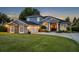Beautiful home featuring stone accents, manicured lawn, and a three car garage at 339 Carolyn Dr, Oviedo, FL 32765