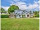 Charming two-story home featuring a well-manicured lawn, stone accents and a double door entryway at 339 Carolyn Dr, Oviedo, FL 32765