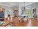 Elegant game room with a pool table, hardwood floors, and decorative chandelier at 339 Carolyn Dr, Oviedo, FL 32765