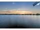 Expansive lake view capturing the serenity of the water and a picturesque sunset backdrop at 339 Carolyn Dr, Oviedo, FL 32765