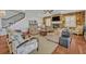 Cozy living room with stone fireplace and ceiling fan at 339 Carolyn Dr, Oviedo, FL 32765