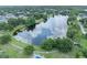 Beautiful pond surrounded by lush greenery and walking paths, a serene community amenity at 339 Carolyn Dr, Oviedo, FL 32765