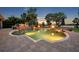 Sparkling in-ground pool with a stone patio, fire bowls, and ample seating at 339 Carolyn Dr, Oviedo, FL 32765